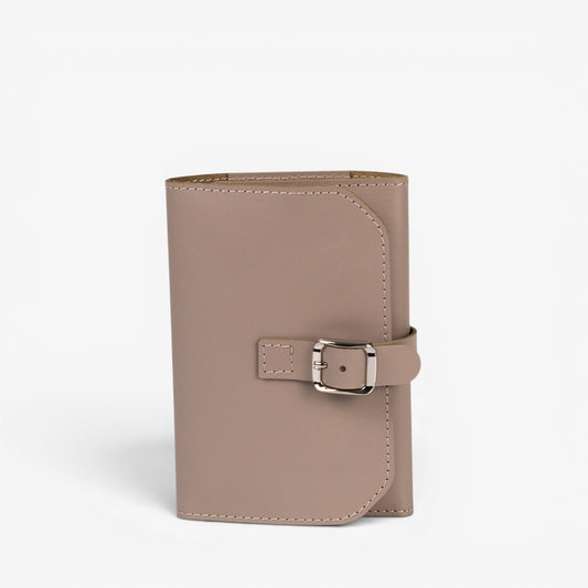 Gray Elin jewelry roll closed with leather buckle strap