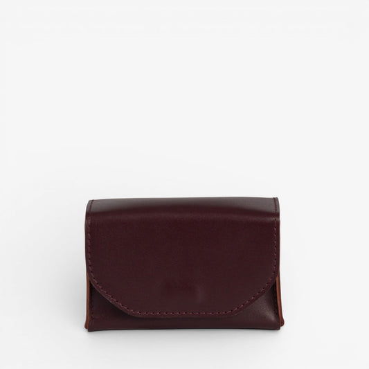 Burgundy Arcana tarot deck case closed with structured leather shape and hidden magnetic closure