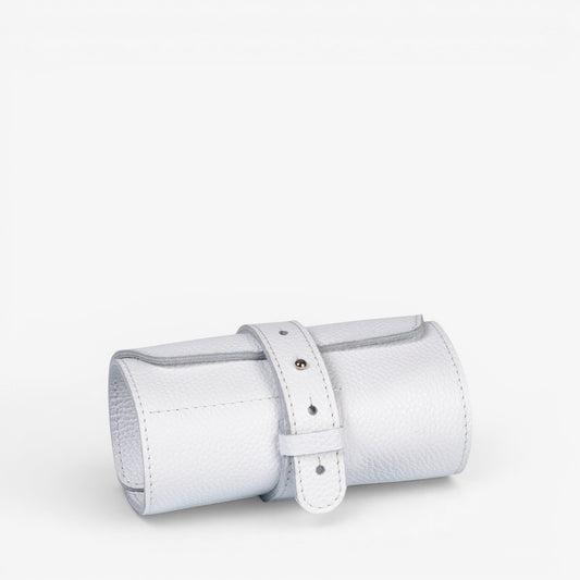 White Aven watch roll closed with strap and metal hardware