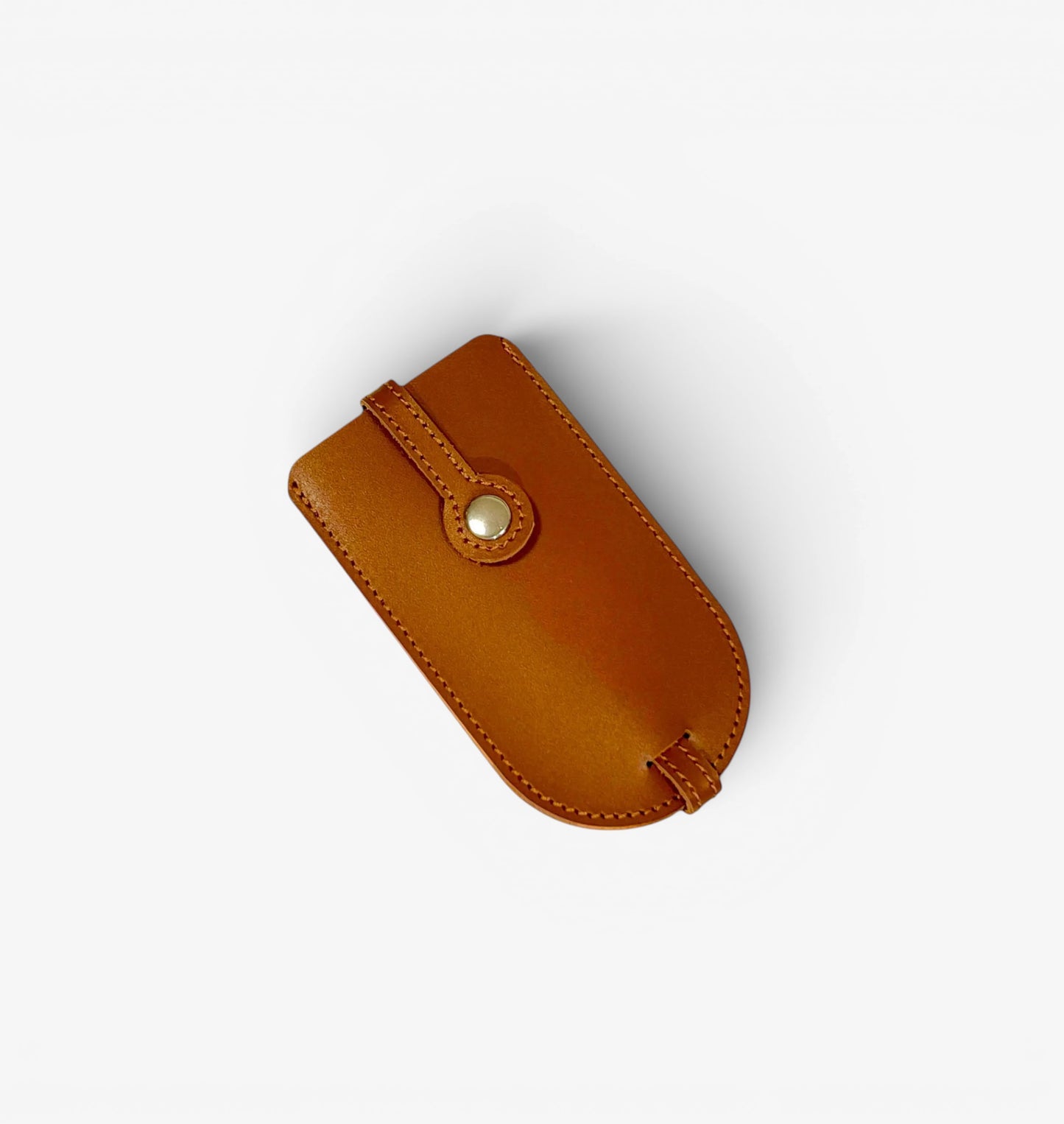 Brown leather pouch with a button on a white background