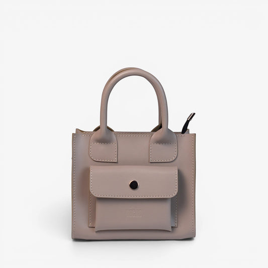 Pache gray smooth leather mini tote bag with a structured shape and front pocket. Adjustable strap for crossbody, shoulder, or hand carry.